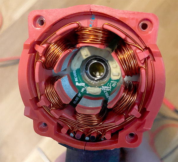 Milwaukee M18 Fuel impact driver with back cap and rotor removed to show the brushless motor